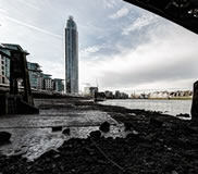 under Vauxhall Bridge, tide out London